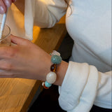 Laura Perlearmbånd - Turkis - ByStenholt.dk